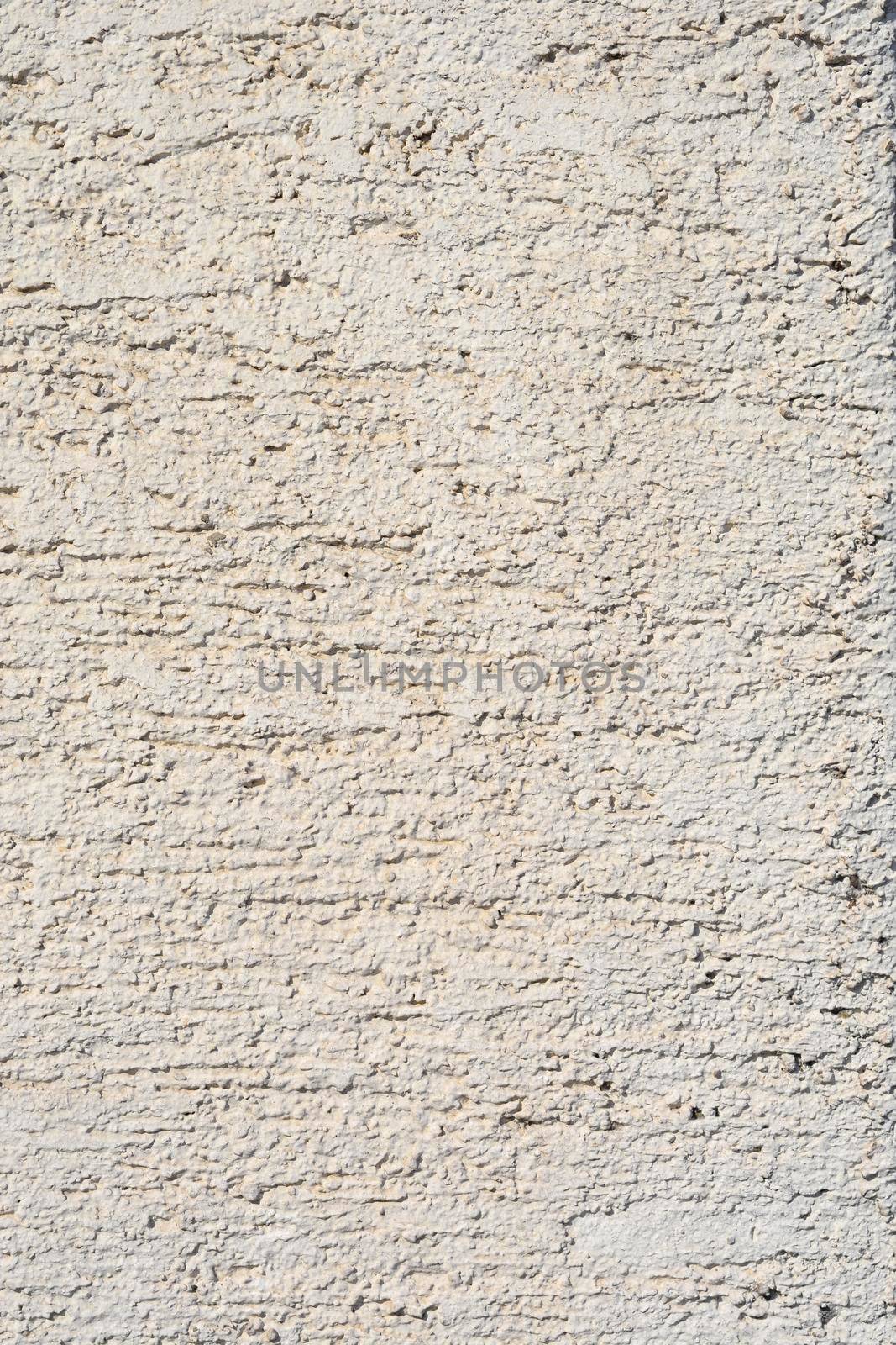 Detail of a white painted rough wall