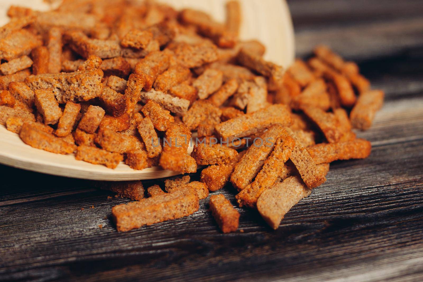 salty croutons snacks delicacy meal wooden table. High quality photo