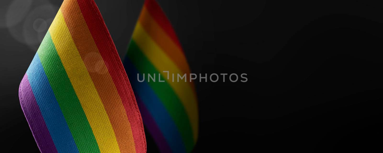 Small national flags of the lgbt on a dark background.