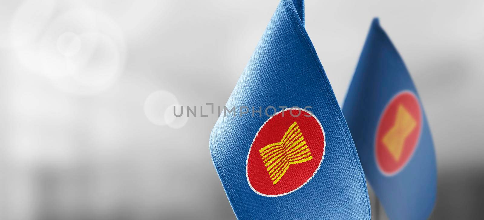 Patch of the national flag of the ASEAN on a white t-shirt by butenkow