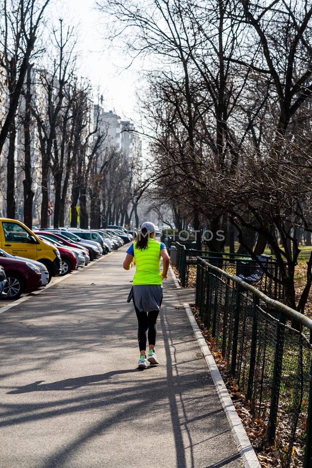 Jogging, running in the city park. Healthy lifestyle, outdoor physical activity and fitness concept in Bucharest, Romania, 2021