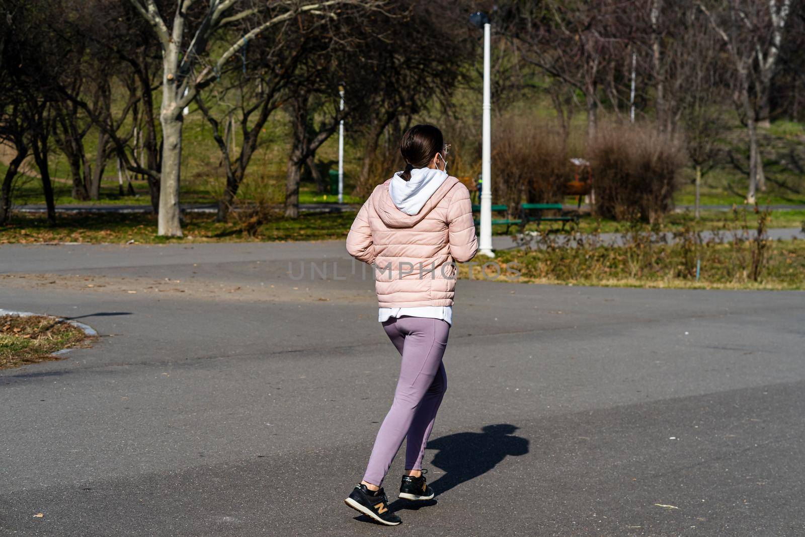 Jogging, running in the city park. Healthy lifestyle, outdoor physical activity and fitness concept in Bucharest, Romania, 2021 by vladispas