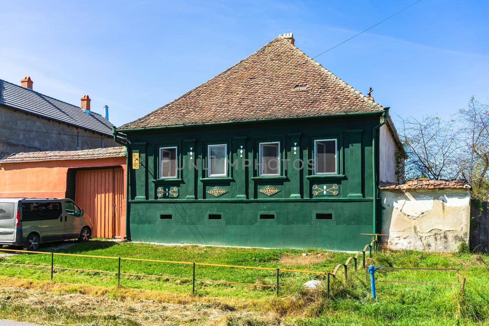 Typical rural landscape and rustic houses in Barcut -Bekokten, Transylvania, Romania, 2021.