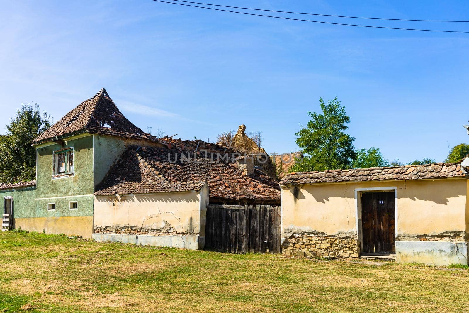 Typical rural landscape and rustic houses in Barcut -Bekokten, Transylvania, Romania, 2021.