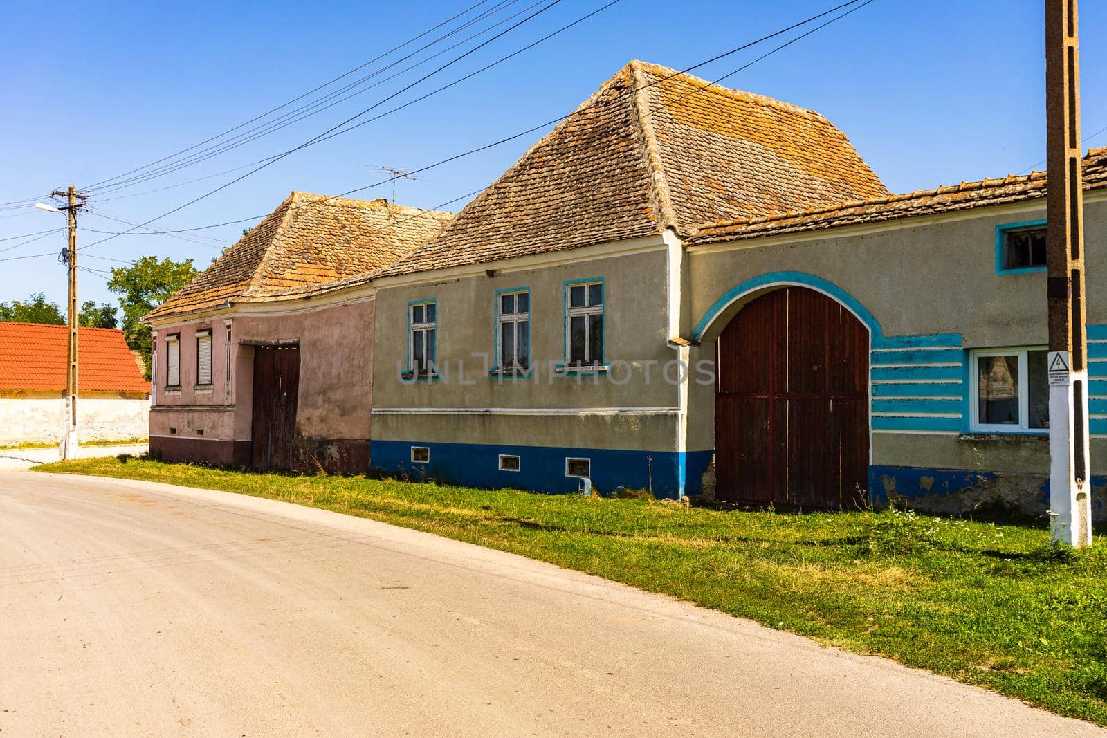 Typical rural landscape and rustic houses in Barcut -Bekokten, Transylvania, Romania, 2021.