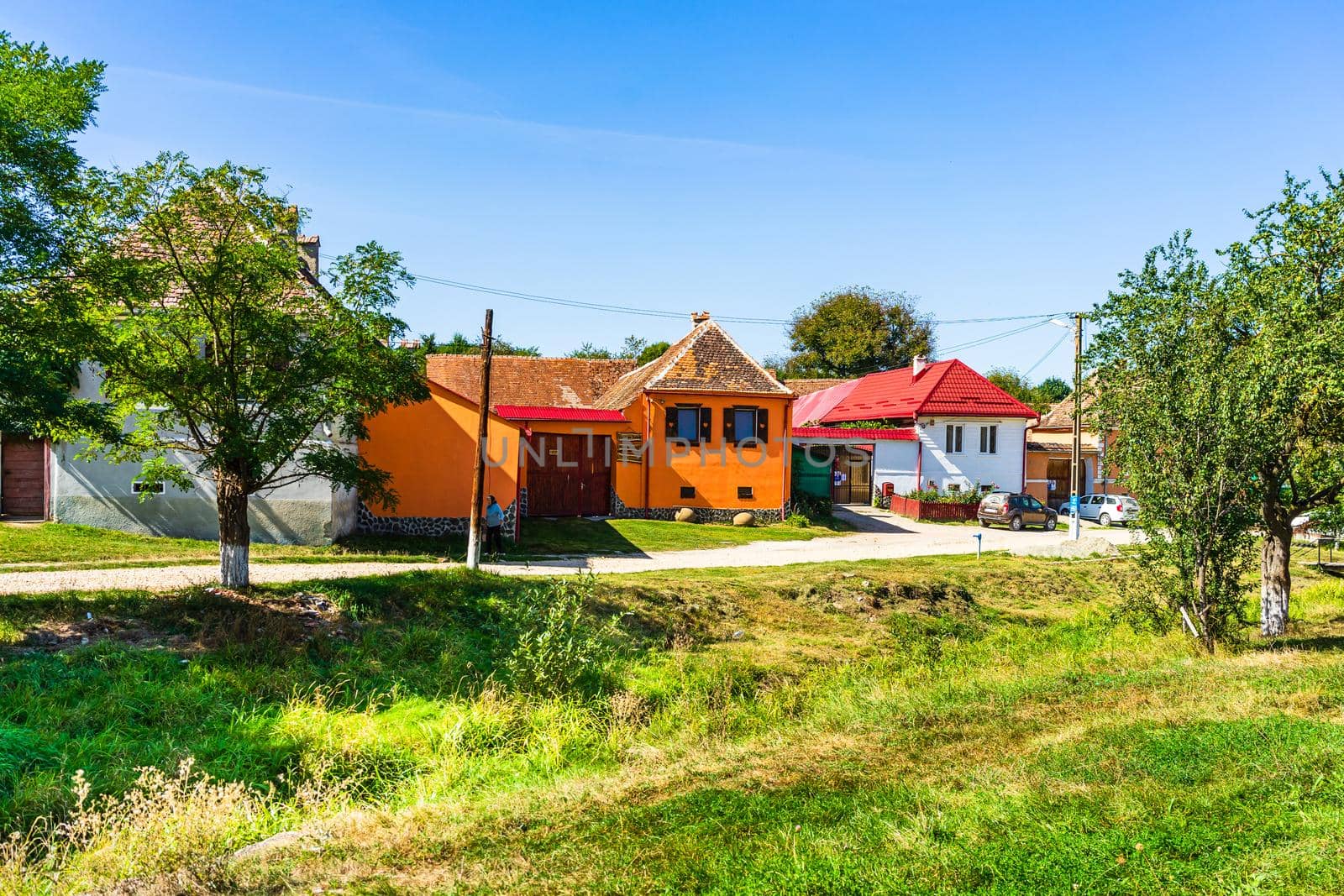 Typical rural landscape and rustic houses in Barcut -Bekokten, Transylvania, Romania, 2021.