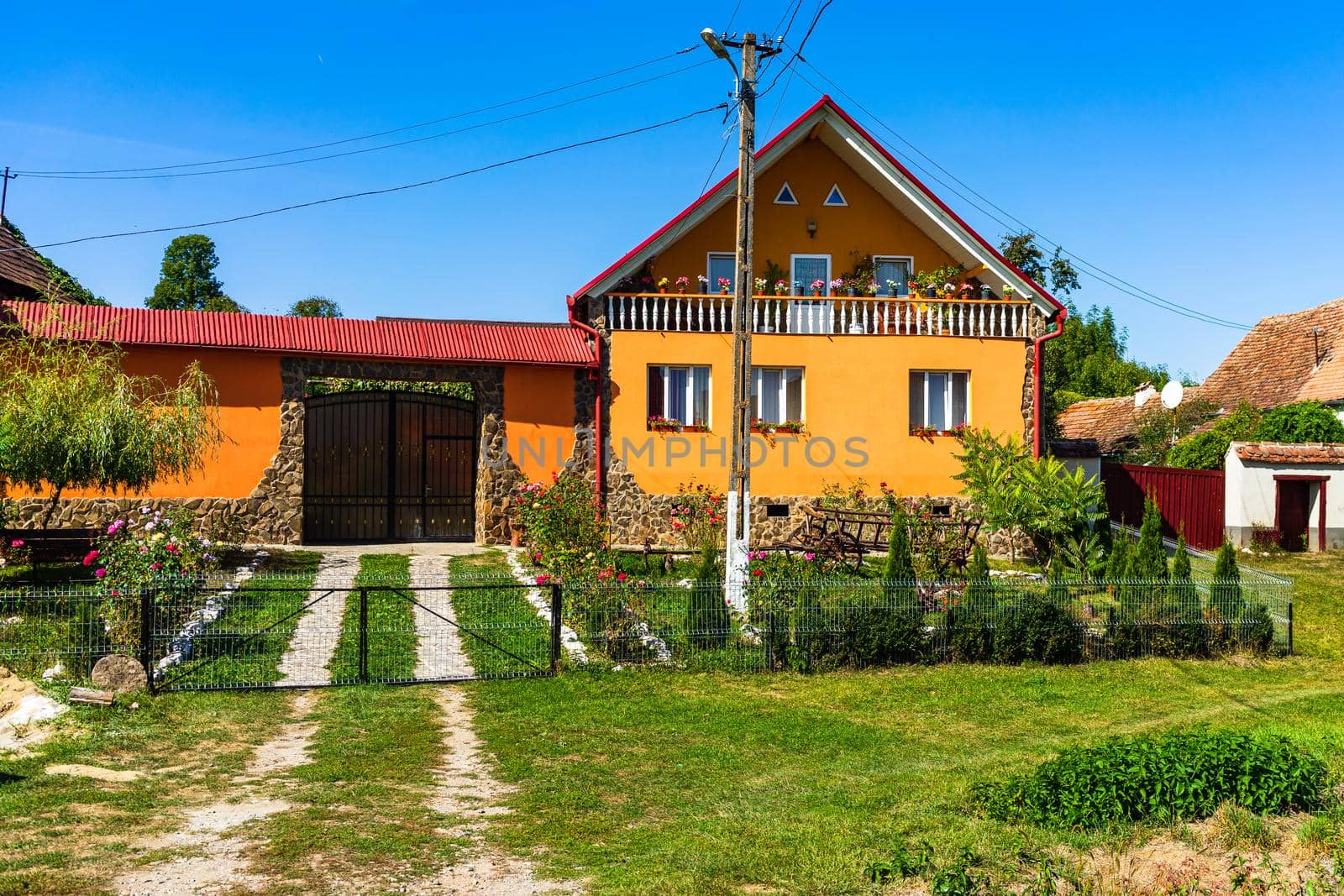Typical rural landscape and rustic houses in Barcut -Bekokten, Transylvania, Romania, 2021.