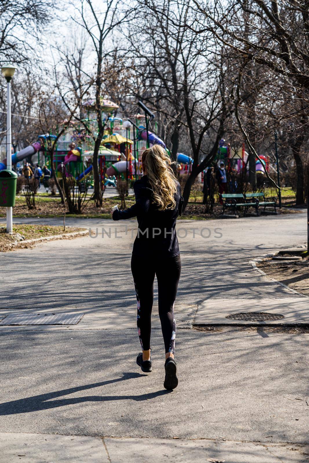 Jogging, running in the city park. Healthy lifestyle, outdoor physical activity and fitness concept in Bucharest, Romania, 2021
