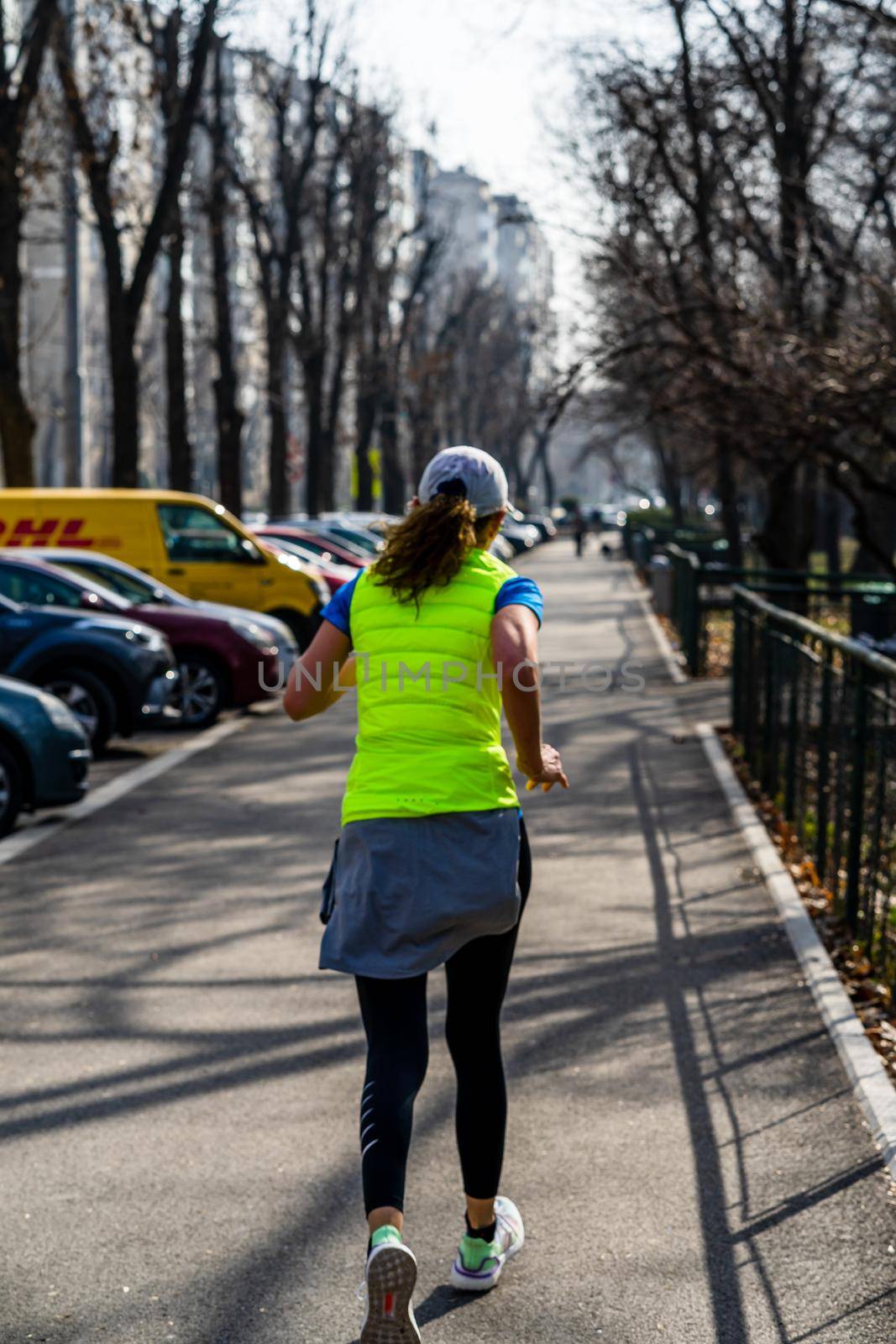 Jogging, running in the city park. Healthy lifestyle, outdoor physical activity and fitness concept in Bucharest, Romania, 2021