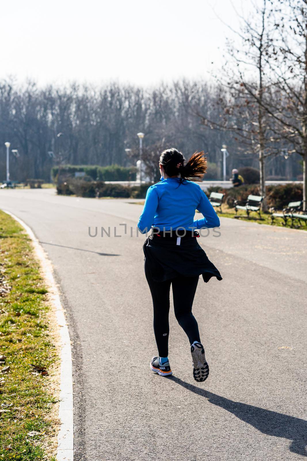 Jogging, running in the city park. Healthy lifestyle, outdoor physical activity and fitness concept in Bucharest, Romania, 2021