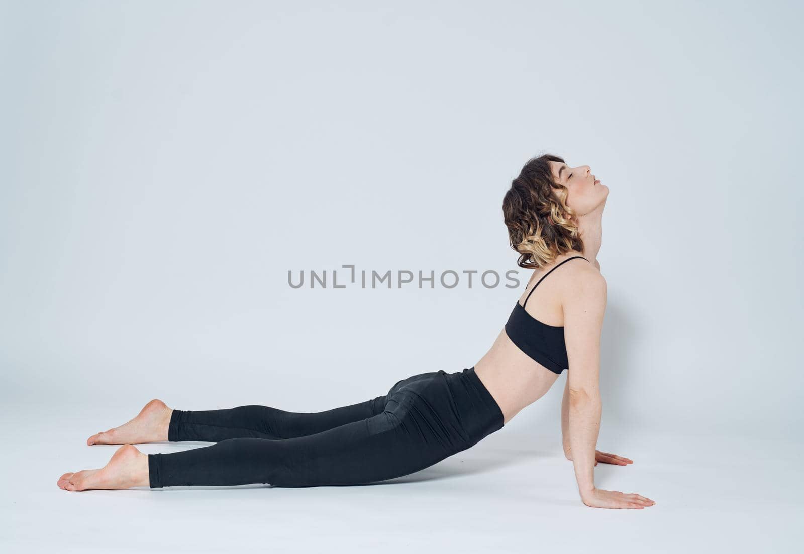 Women doing push-ups In a light room, sports meditation yoga asanas. High quality photo
