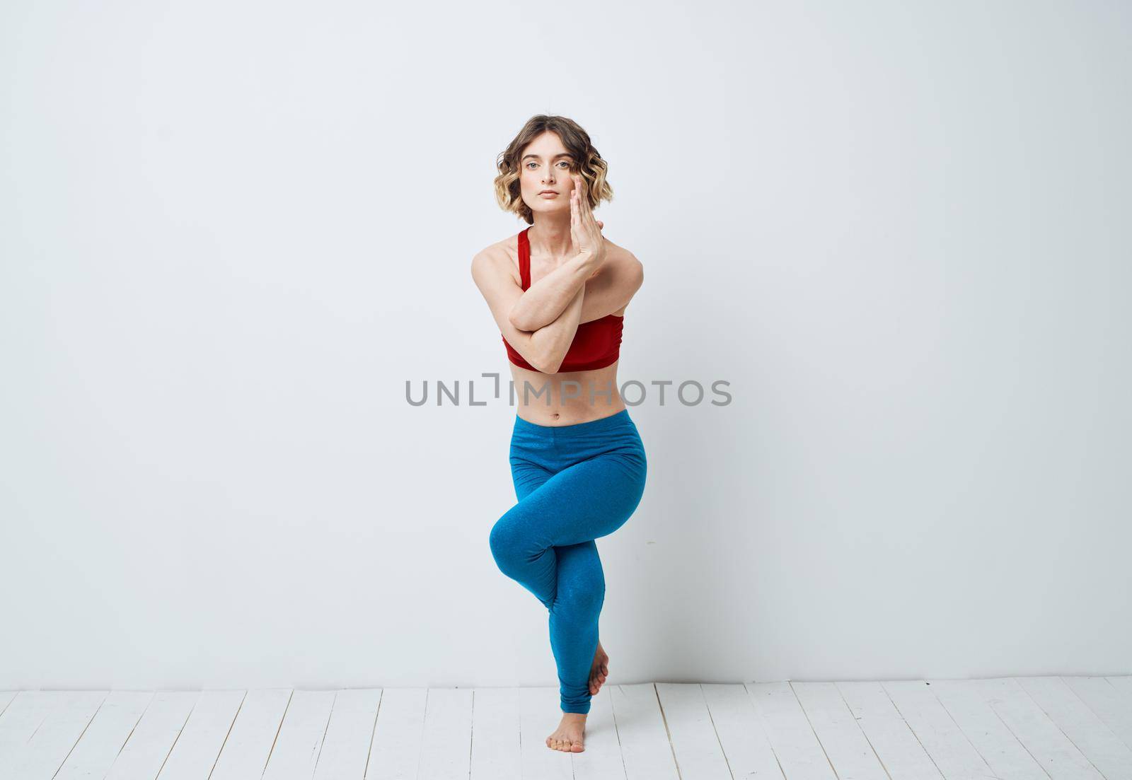 woman in blue leggings gymnastics sport fitness yoga asana by SHOTPRIME