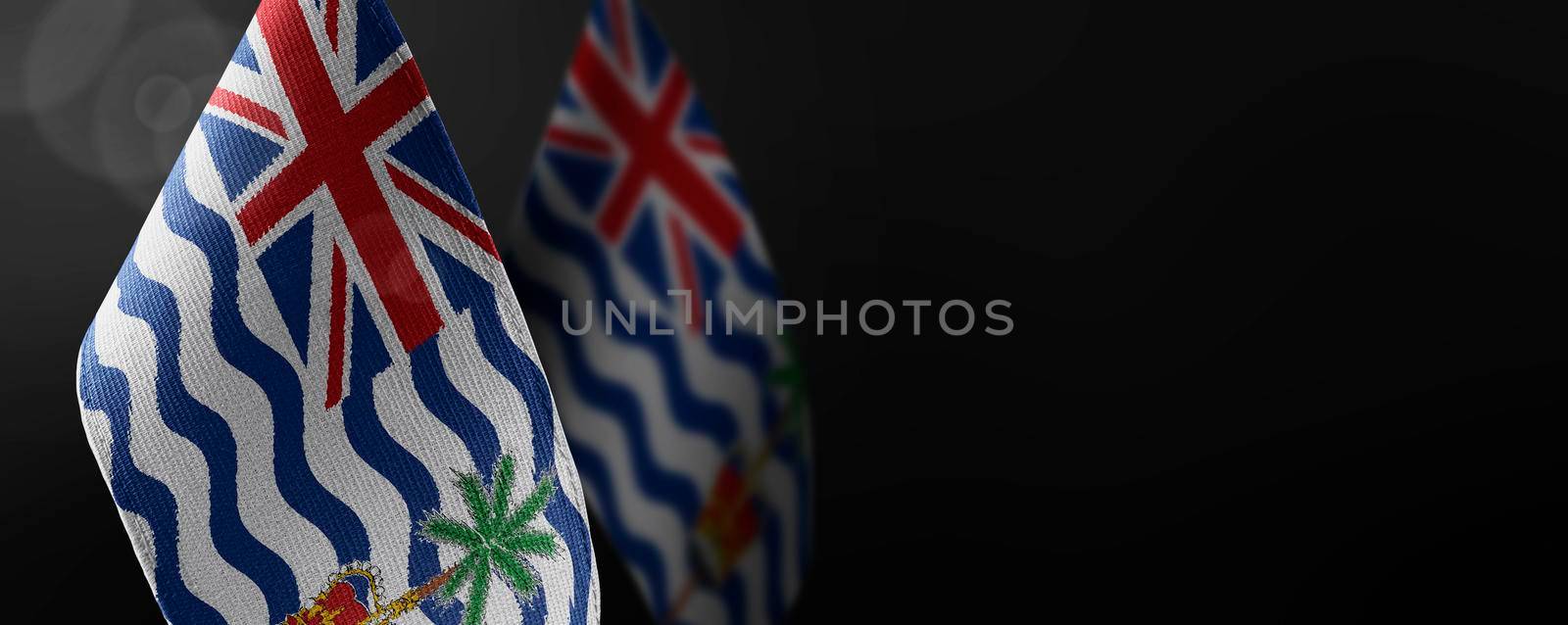 Small national flags of the British Indian Ocean Territory on a dark background.