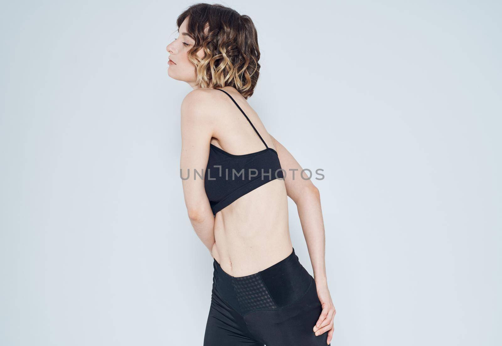 sports woman fitness yoga meditation model light background. High quality photo