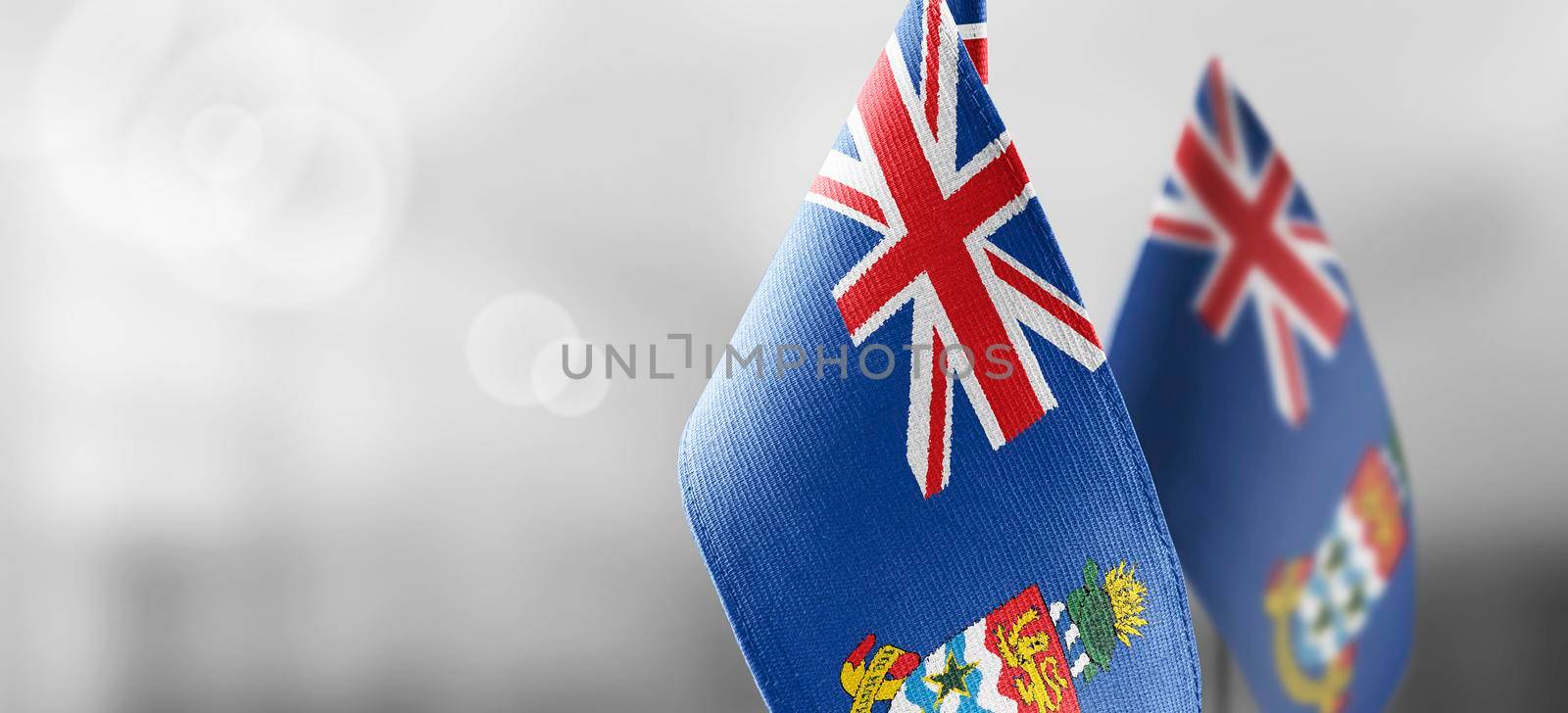 Patch of the national flag of the Cayman Islands on a white t-shirt by butenkow