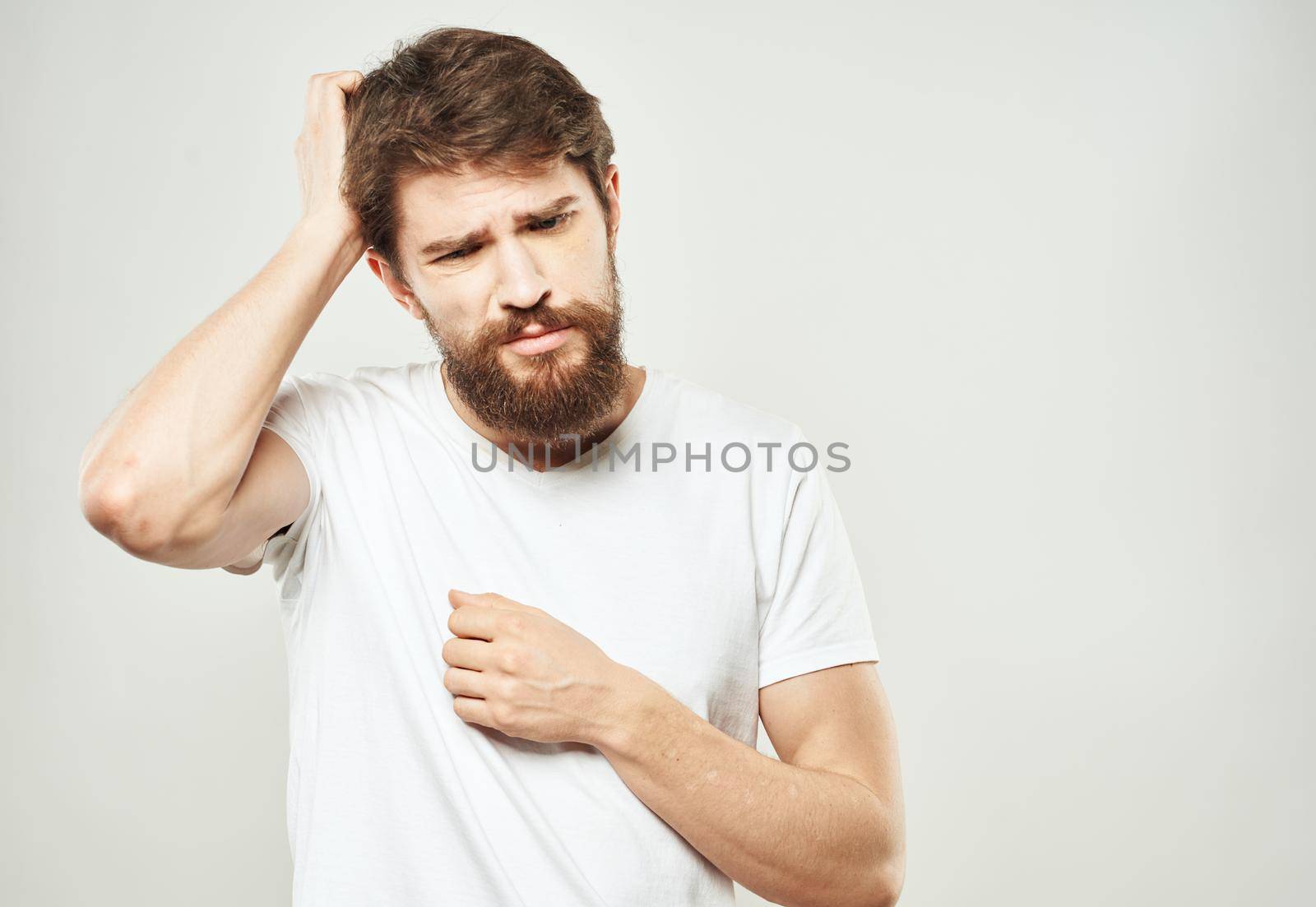 The guy gestures with his hands a puzzled look of emotion of bewilderment. High quality photo