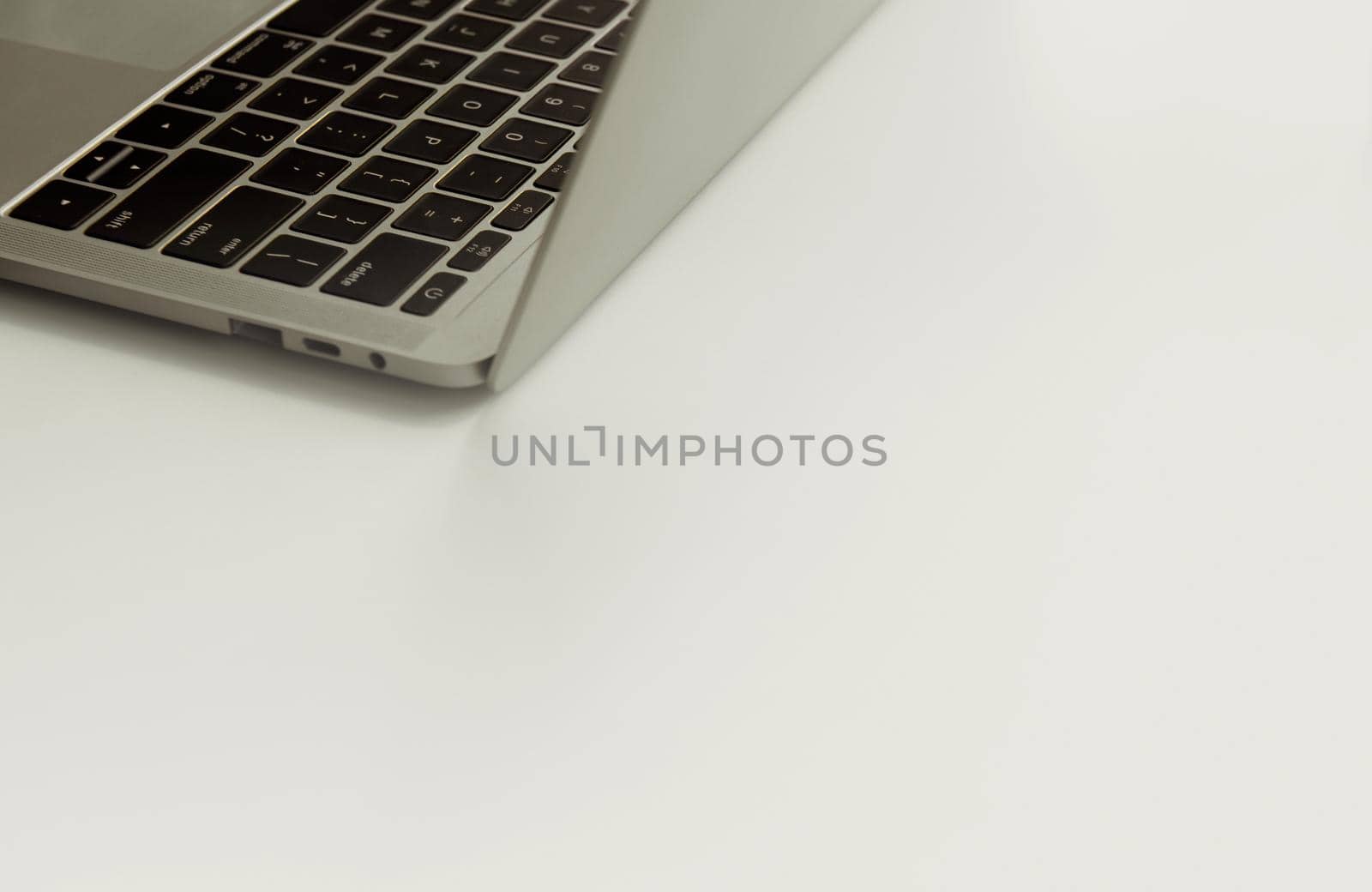 Laptop in angled position isolated on white background. by thanumporn