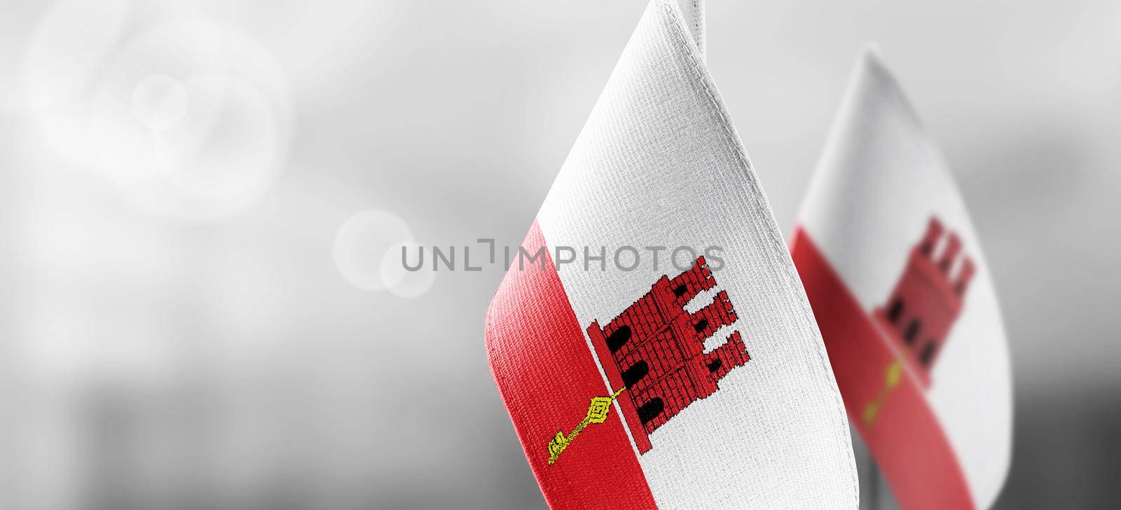 Patch of the national flag of the Gibraltar on a white t-shirt by butenkow