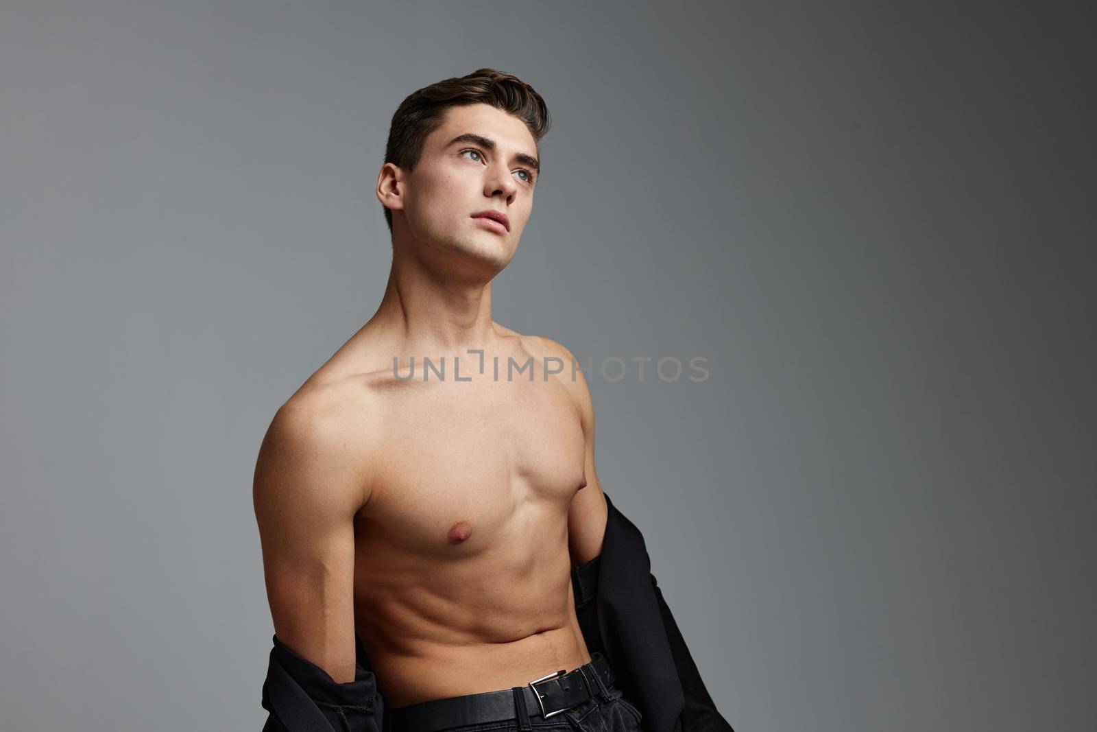 handsome man naked torso black shirt cuteness posing model. High quality photo