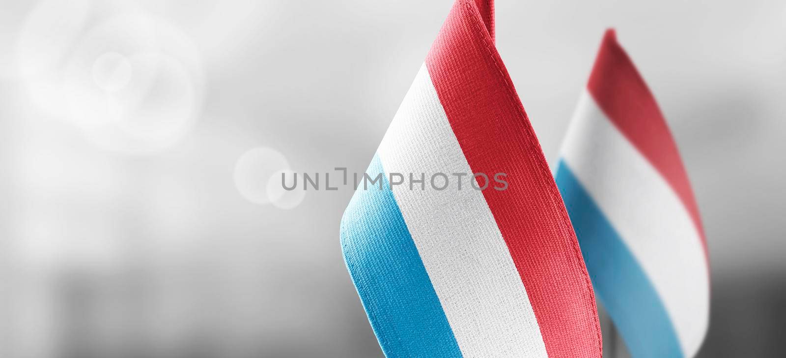 Patch of the national flag of the Luxembourg on a white t-shirt.