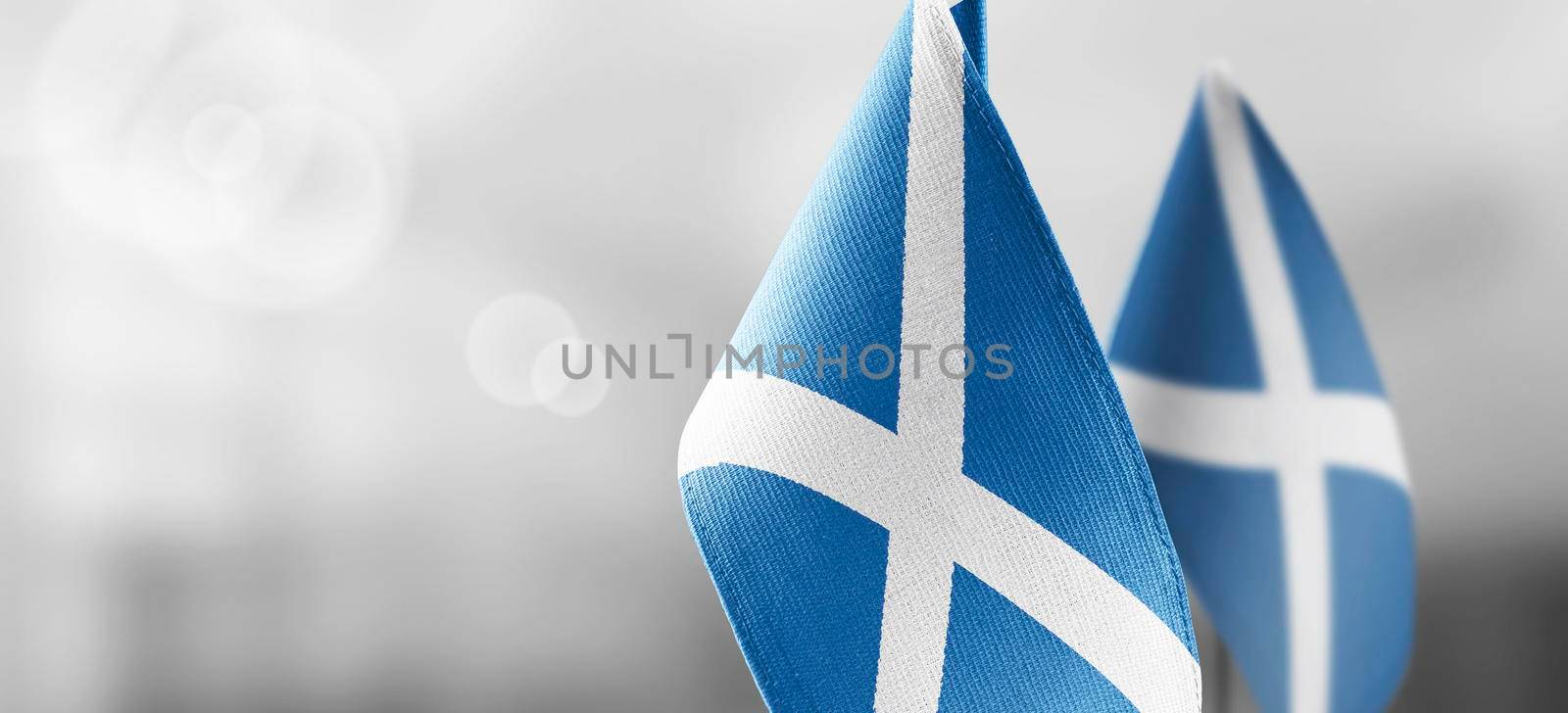 Patch of the national flag of the Scotland on a white t-shirt.