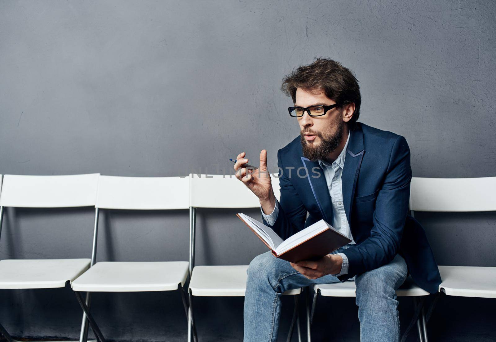 Man sitting on a chair one waiting job interview job. High quality photo