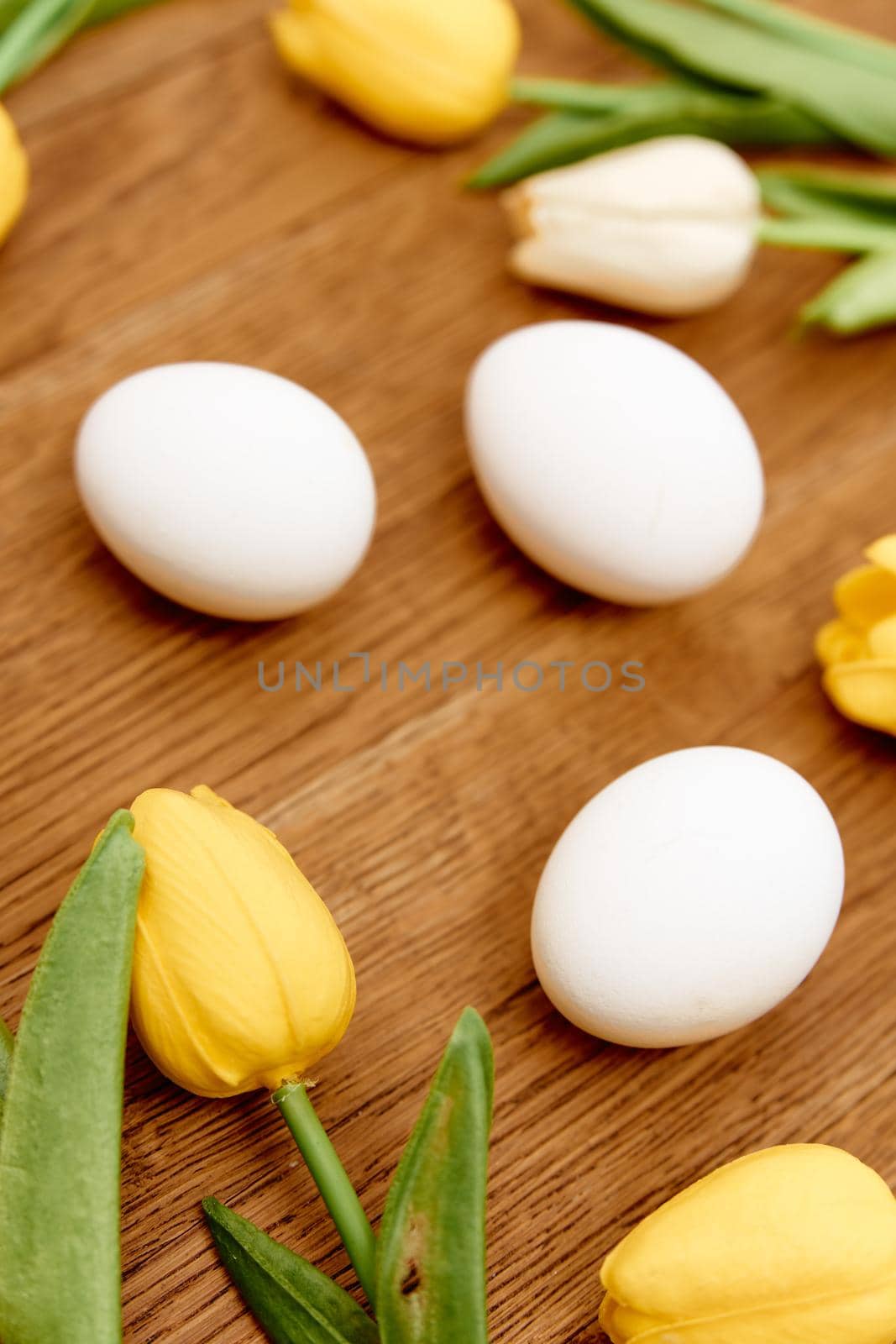 chicken eggs bouquet flowers wooden background close-up easter by SHOTPRIME