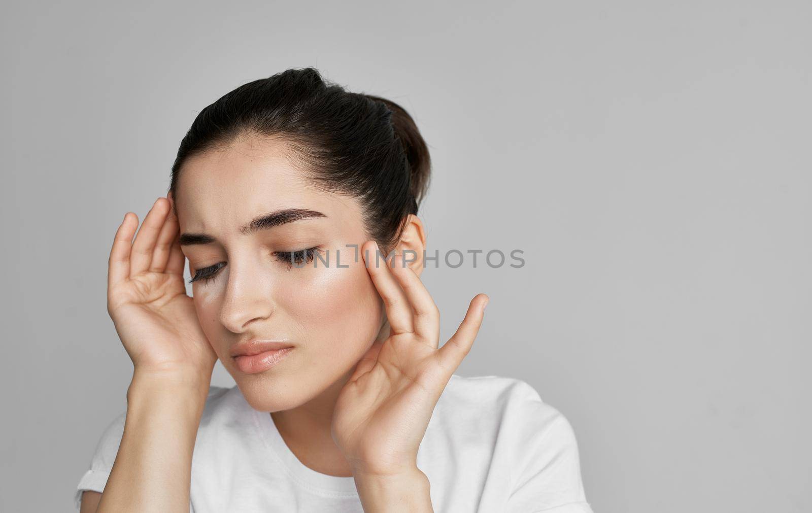 woman in white t-shirt cropped view health problem headache. High quality photo