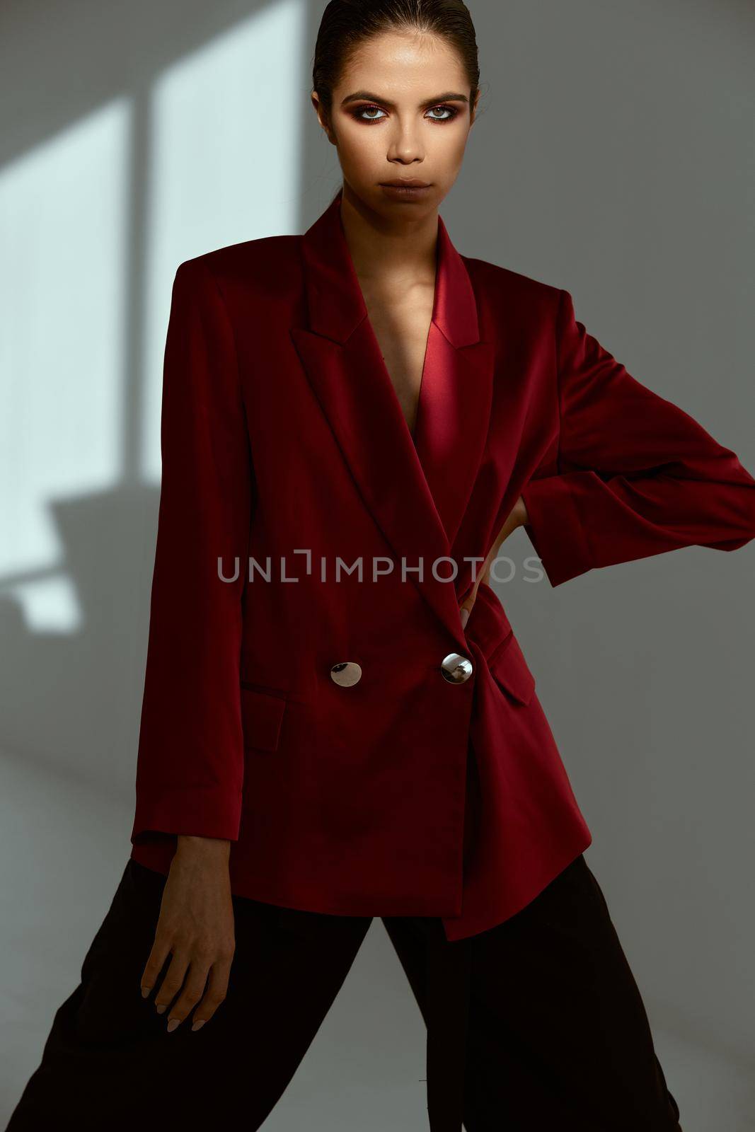 pretty woman in red blazer studio fashion cropped view. High quality photo