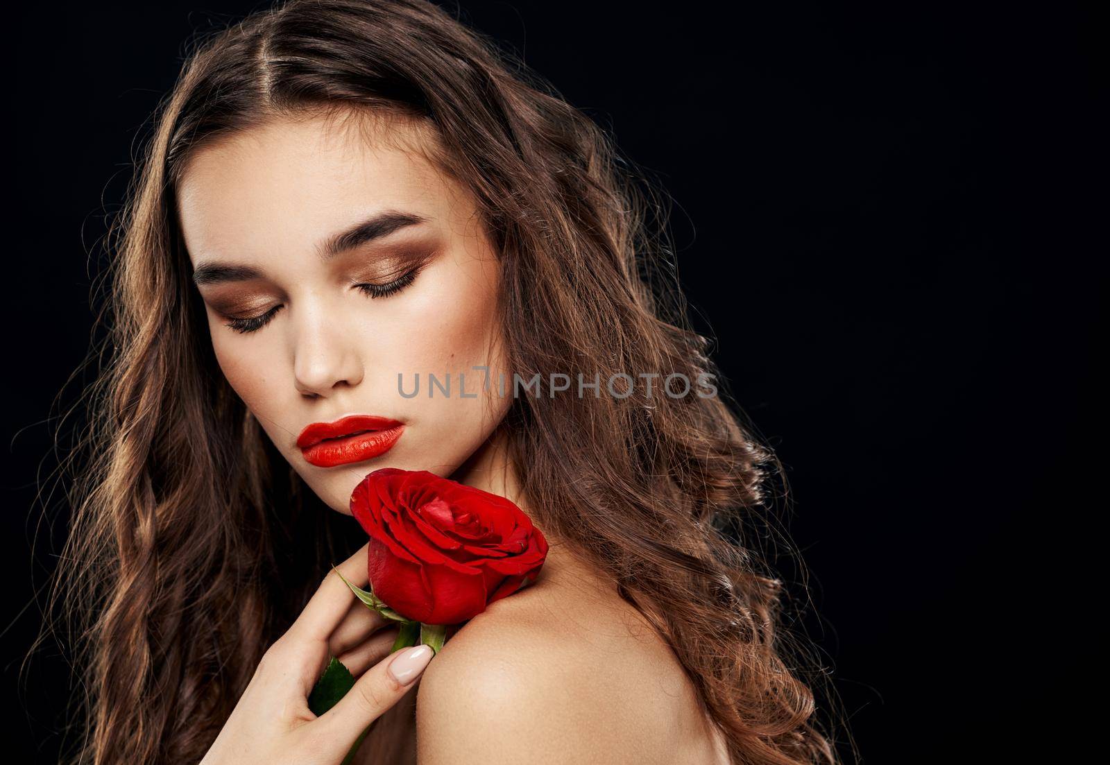 Romantic Lady dark background shadows on the eyelids Makeup on the face closed eyes. High quality photo