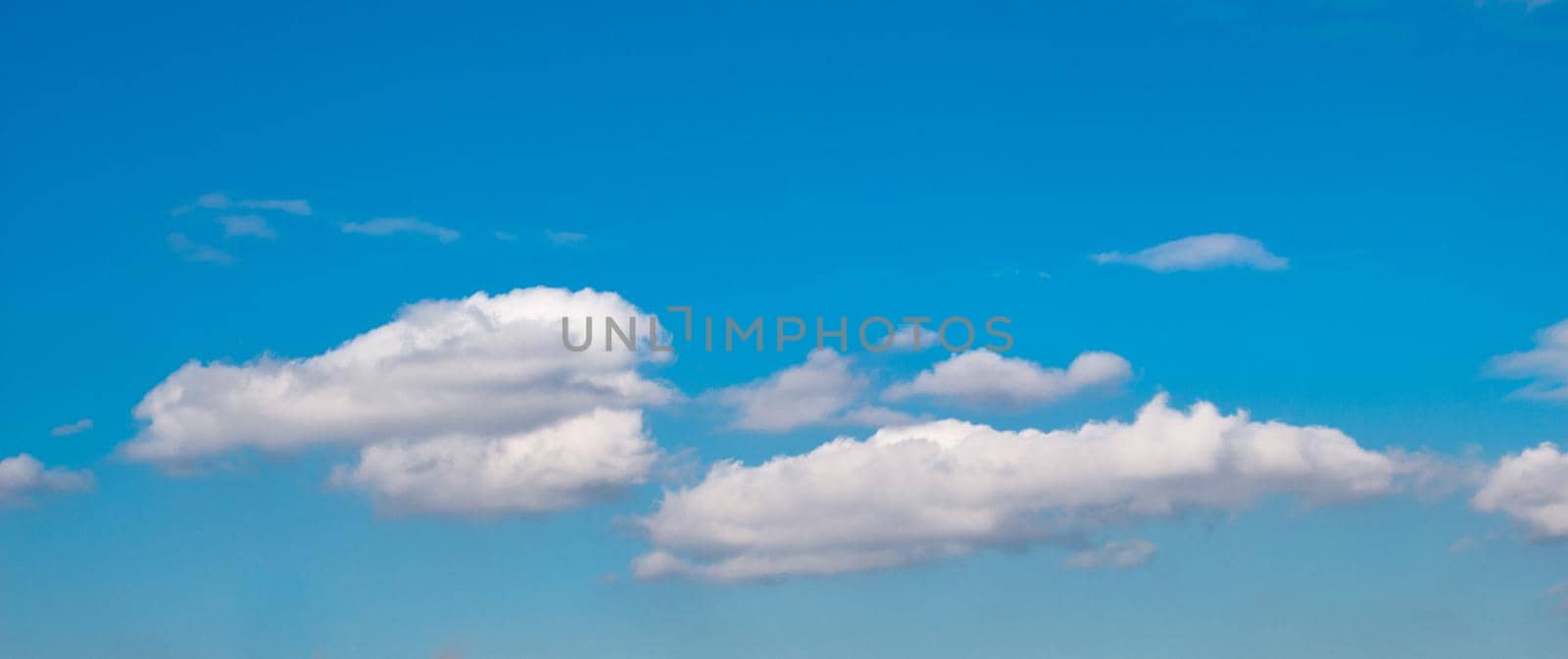 White color clouds found in the  blue sky background