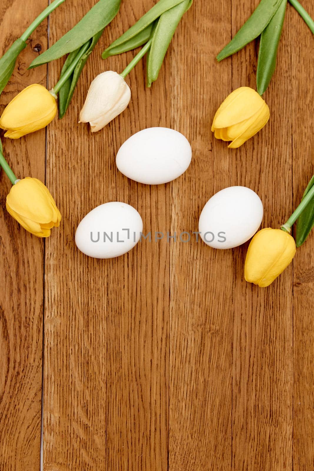 bouquet of spring flowers easter eggs decoration wooden background Copy Space. High quality photo