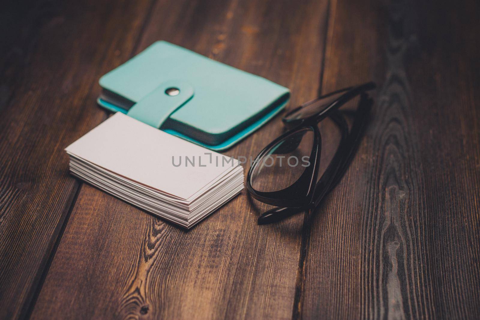 glasses business cards wallet wooden background and texture finance office by SHOTPRIME