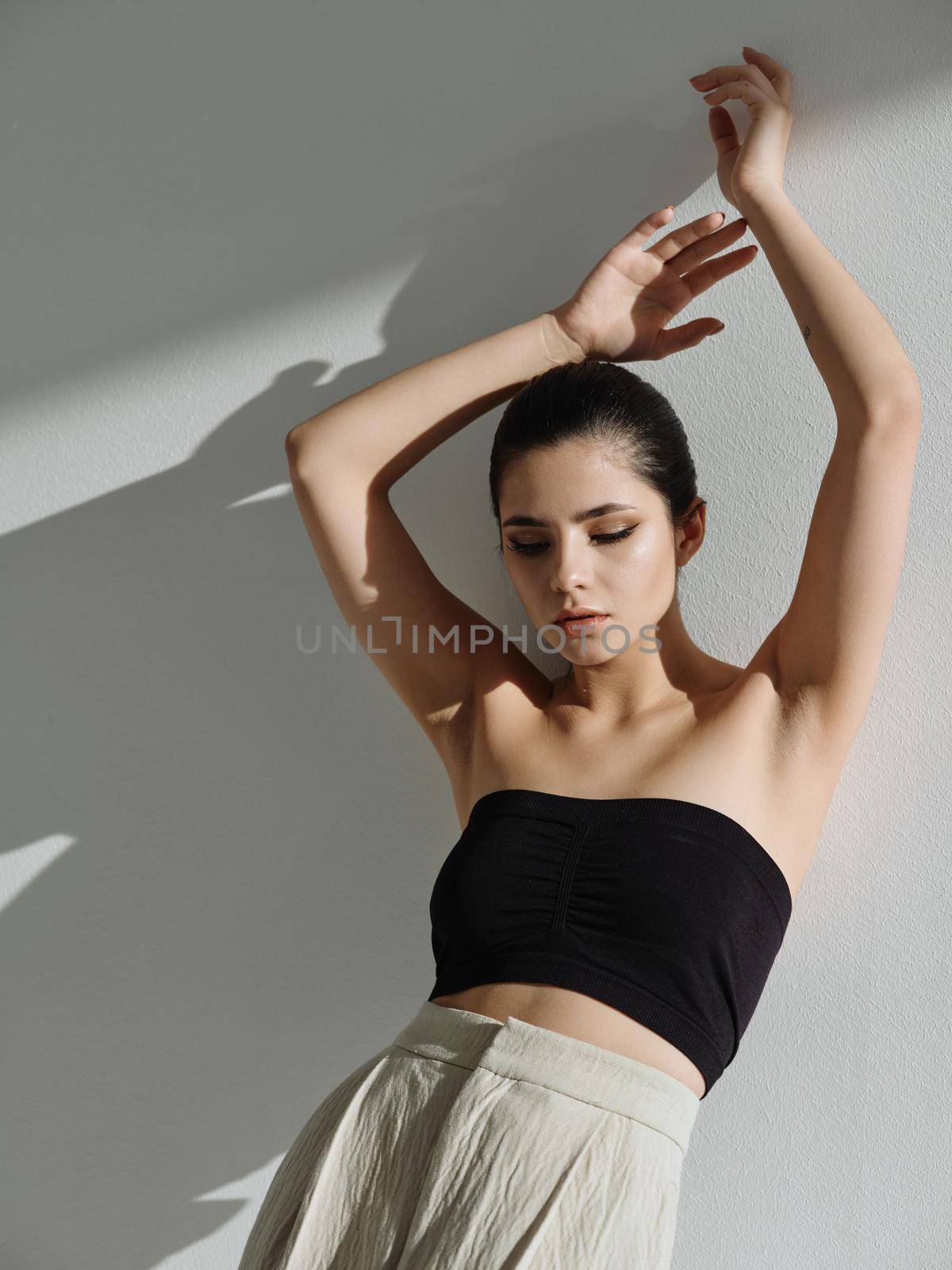 woman leaning on the wall fashion attractive look model. High quality photo