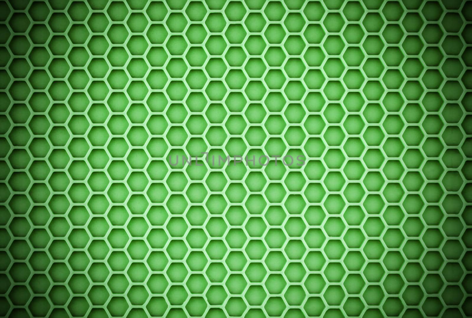 abstract green honeycomb unobtrusive sharp background with vignette.