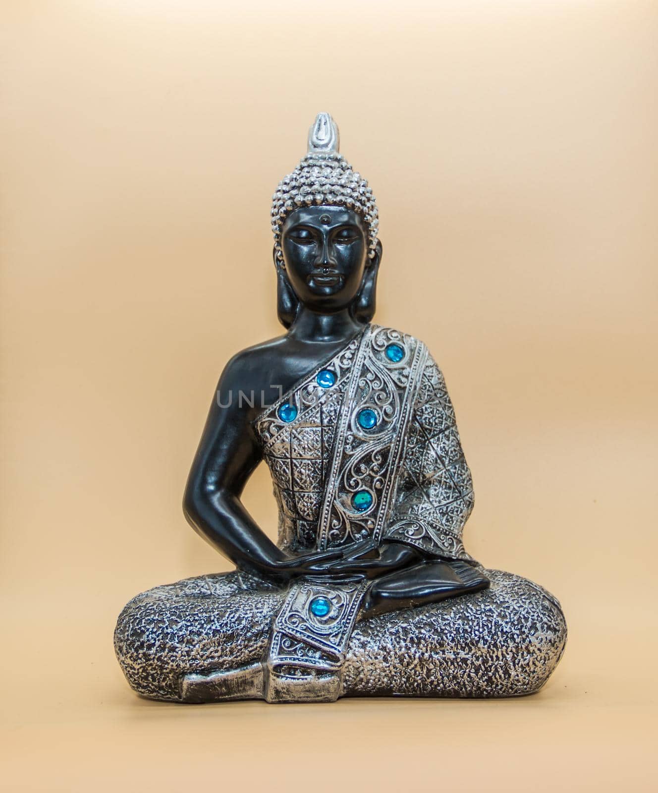 small buddha image isolated on light background