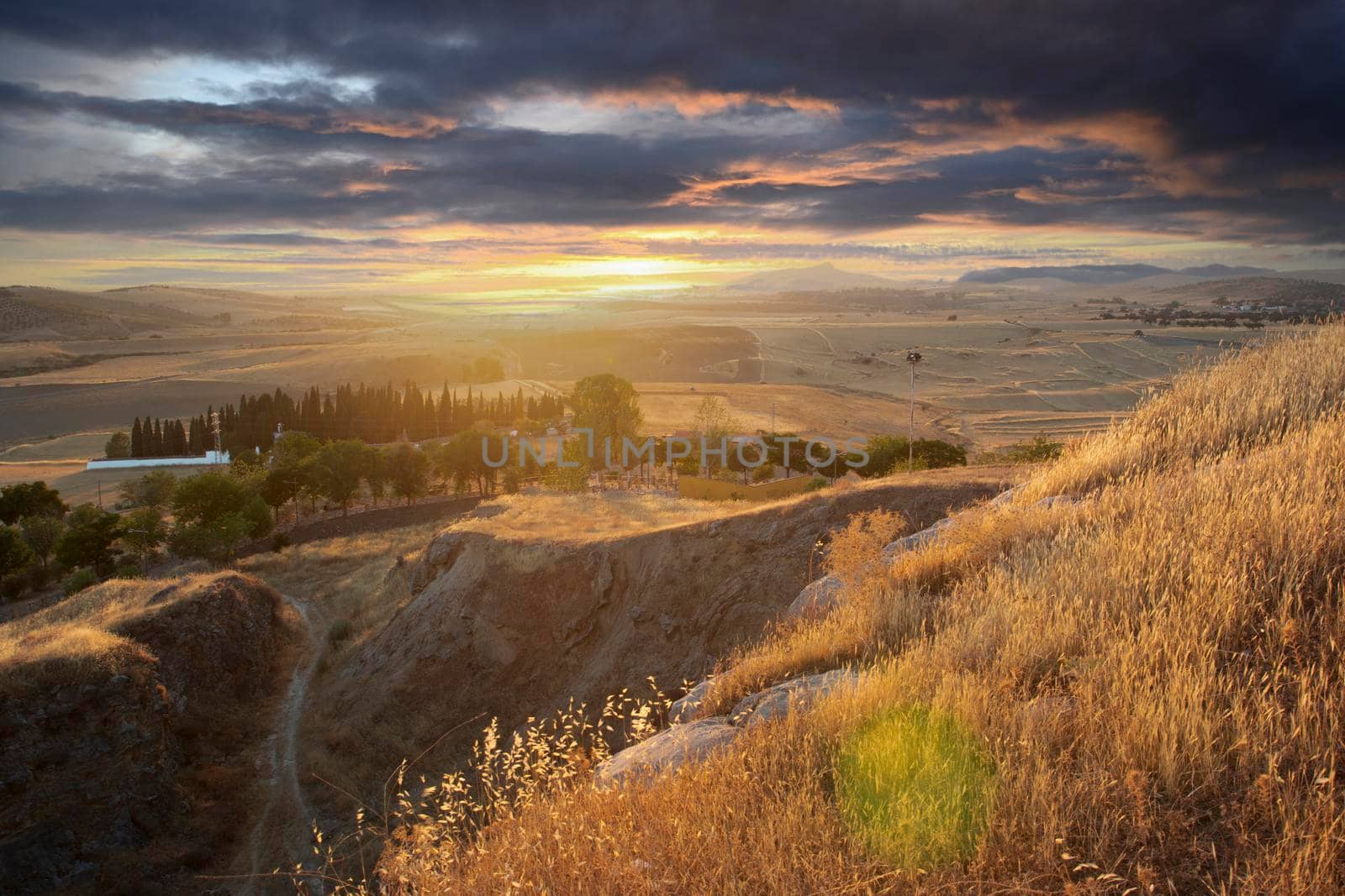 Small Andalusian town in southern Spain with clouds by loopneo