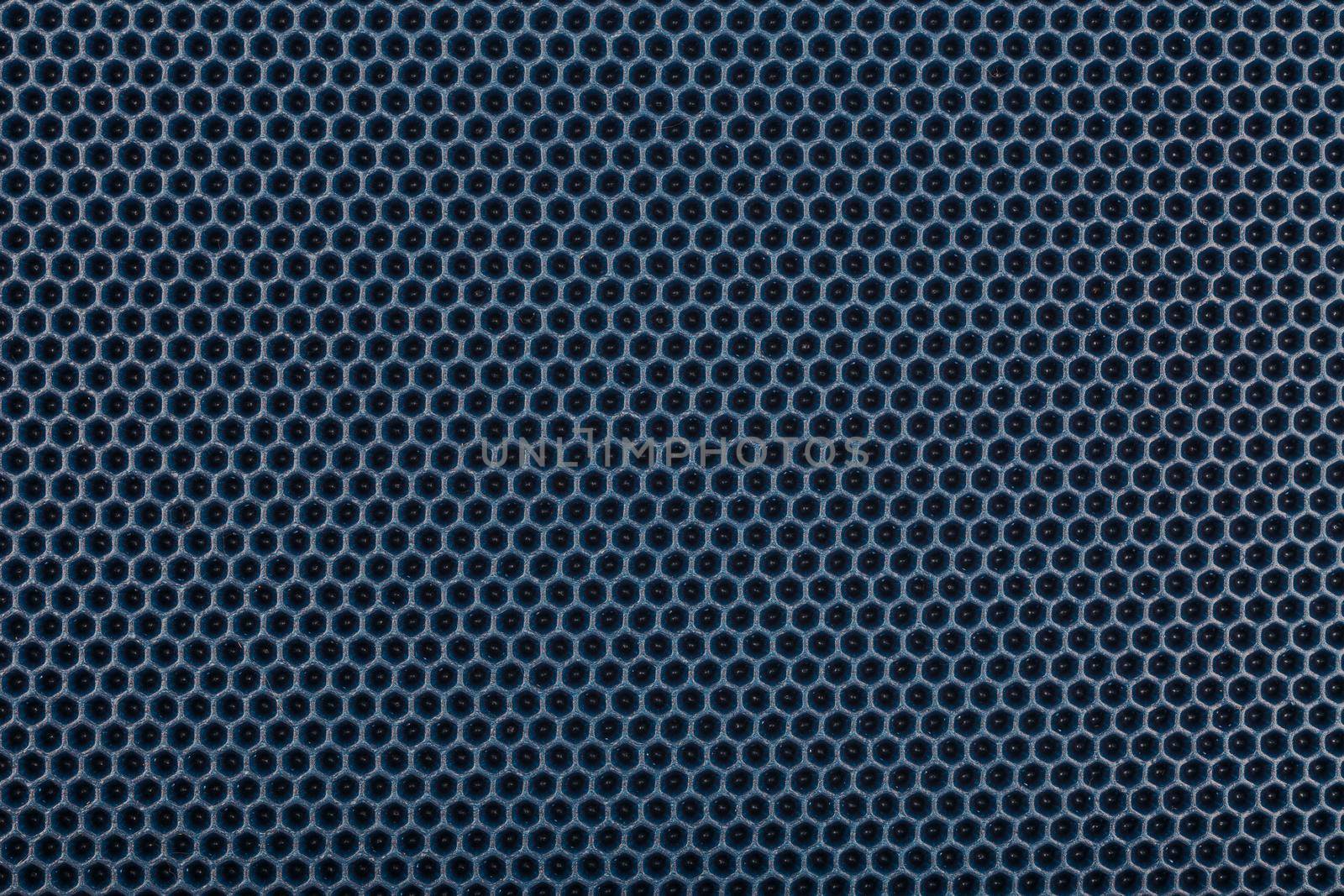 blue hexagonal punched EVA - ethylene vinyl acetate foam carpet, flat full frame texture and background.
