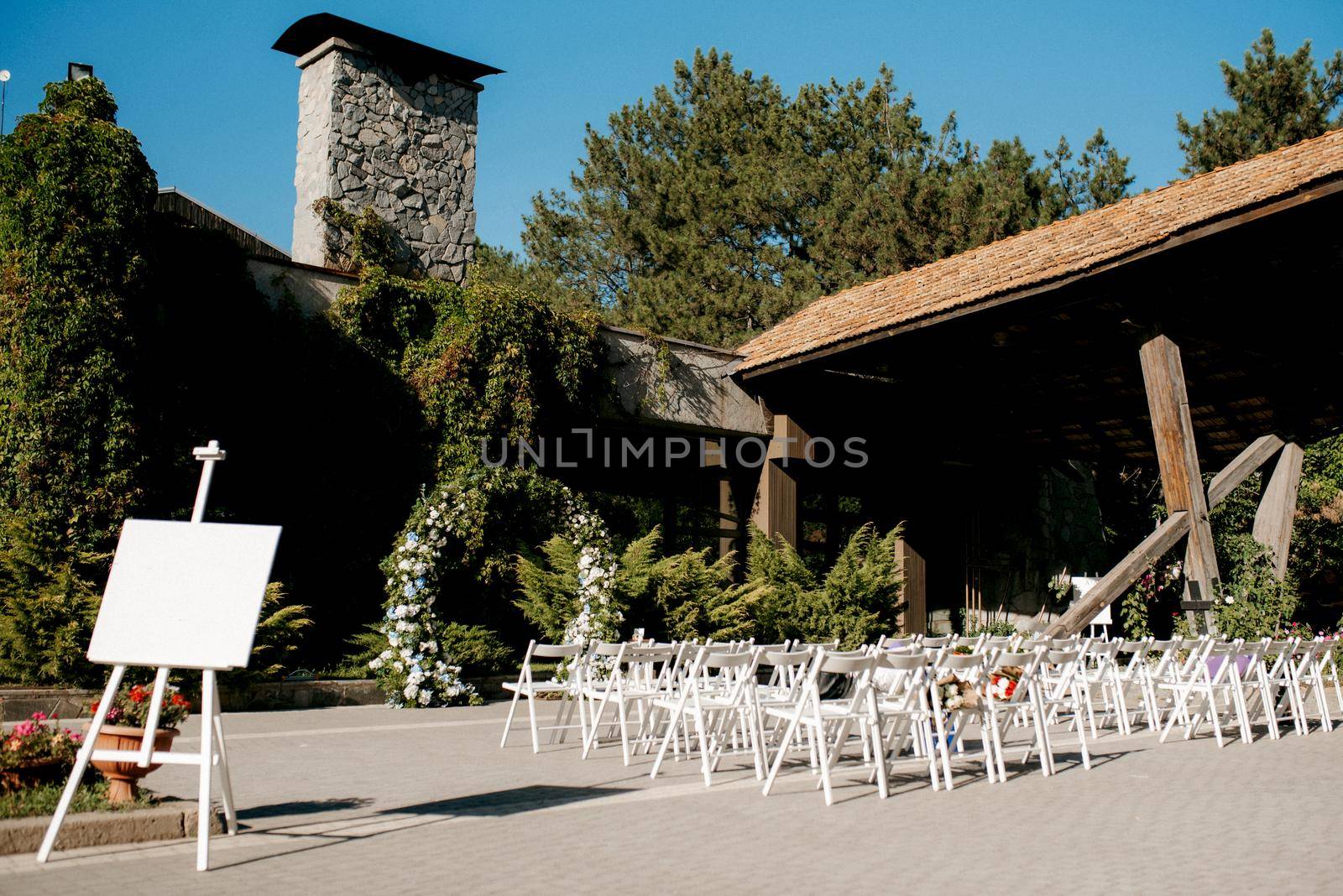 wedding ceremony in the woods among the trees on the green track by Andreua