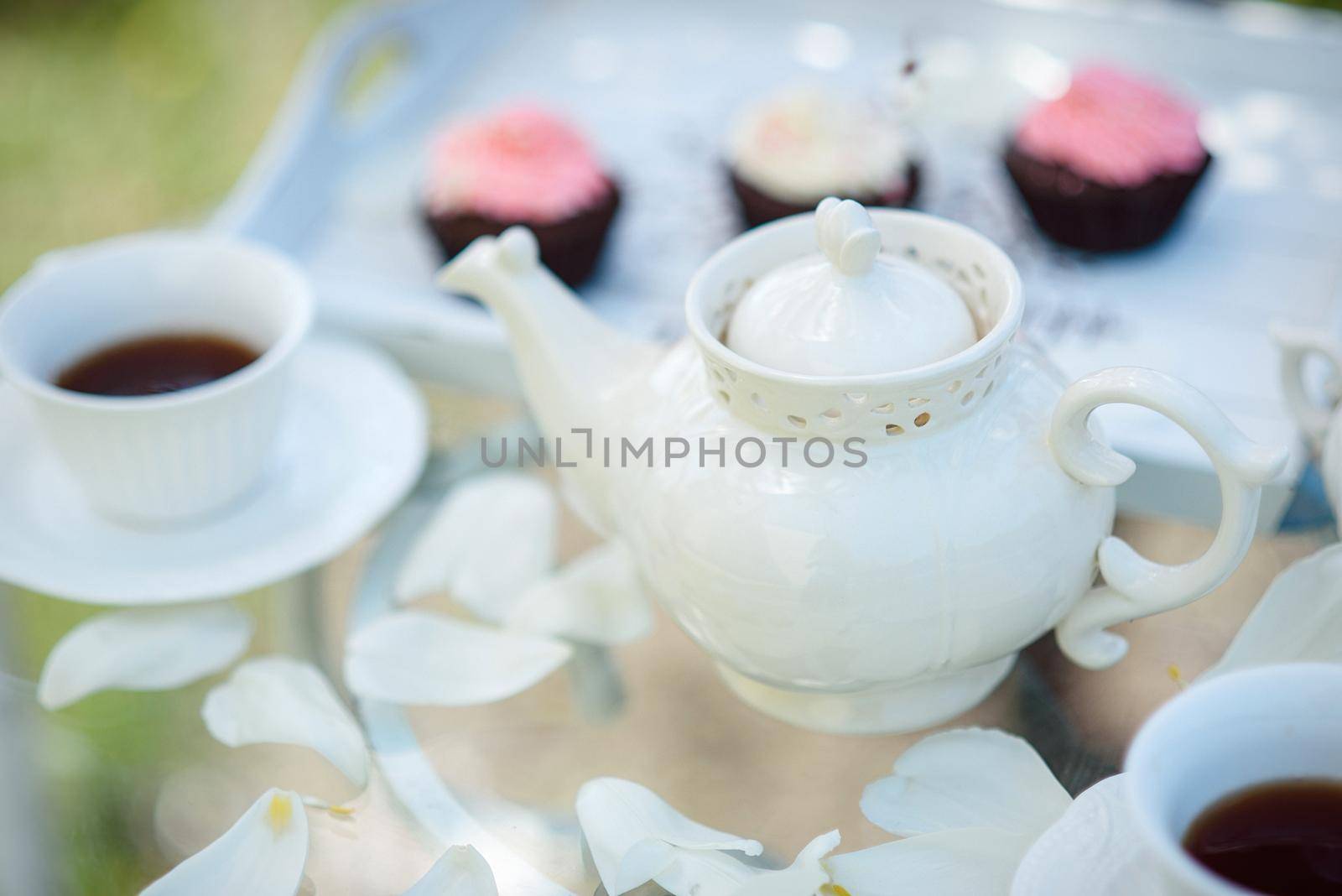 Tea drinking black tea with porcelain cups and a teapot by Andreua