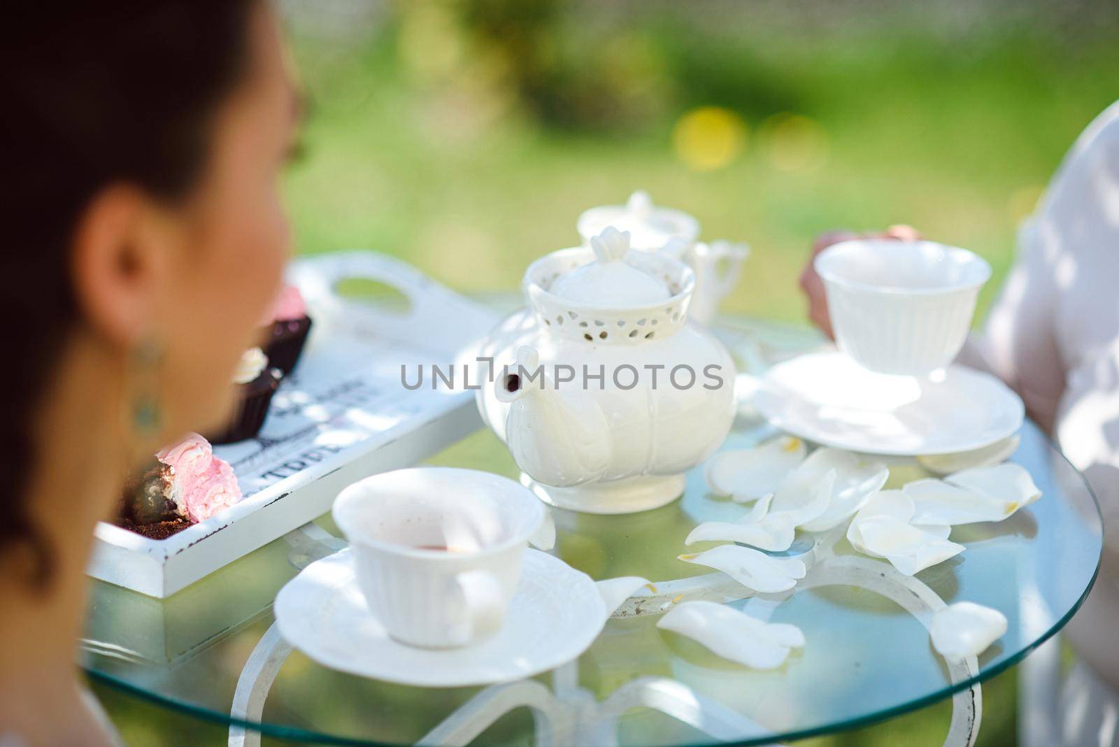 Tea drinking black tea with porcelain cups and a teapot