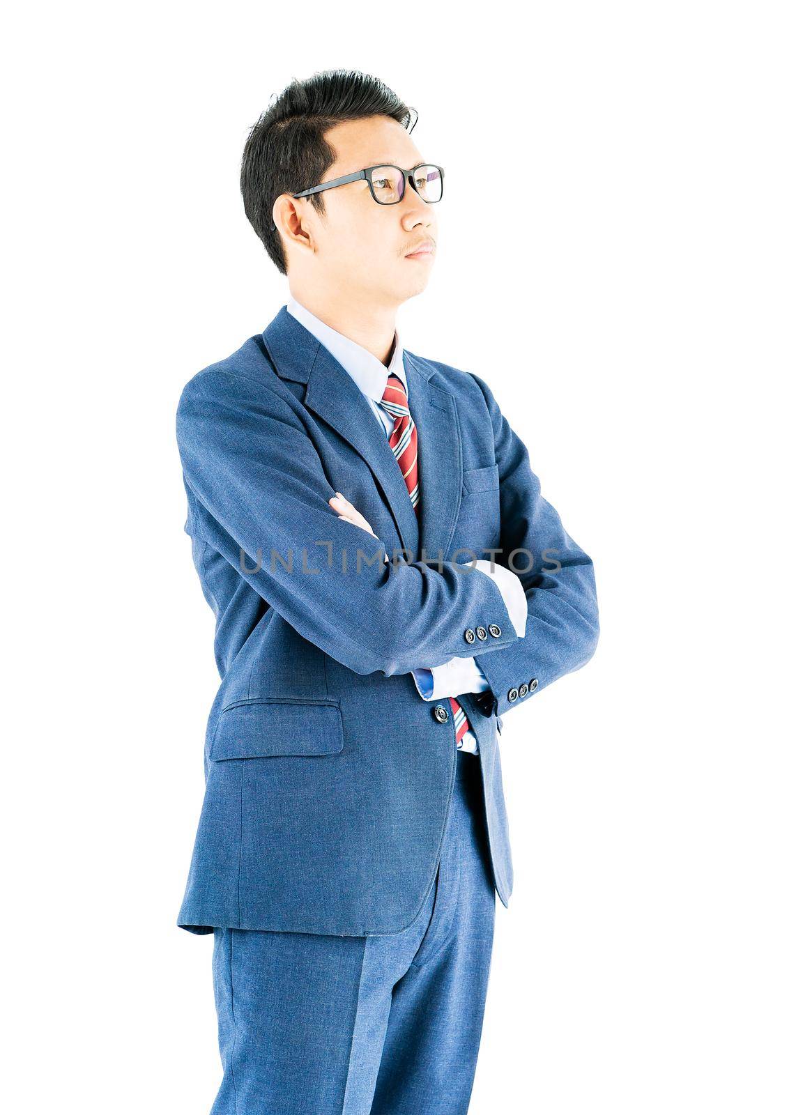 Young asian businessman portrait in suit and arms crossed over white background