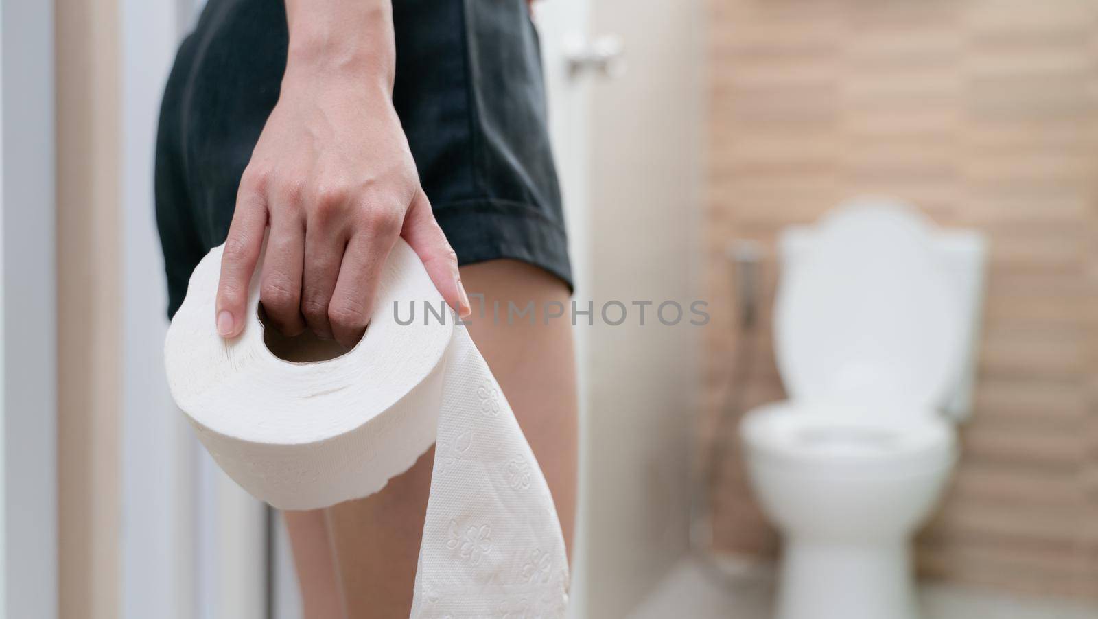 woman with toilet paper, stomachache diarrhea symptom, menstrual period cramp or food poisoning. Health care concept.