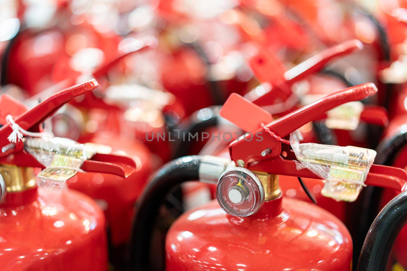 A lot red tank of fire extinguishers. protection and security concept.