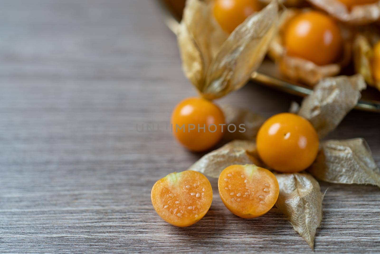 Top view pile of cape gooseberry fruit on the table.