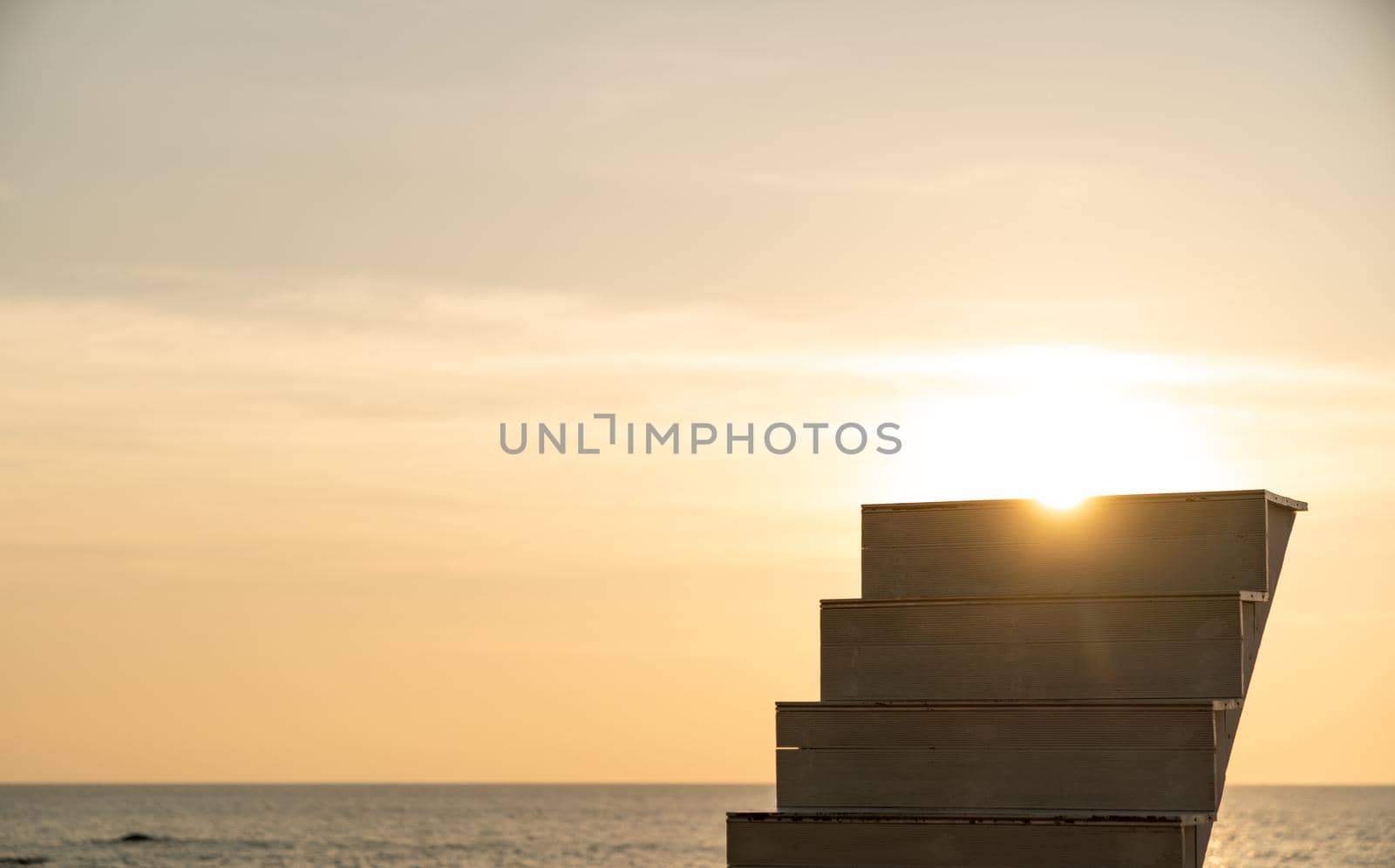 Empty silhouette staircase walk way up on the in the sky with sunset.