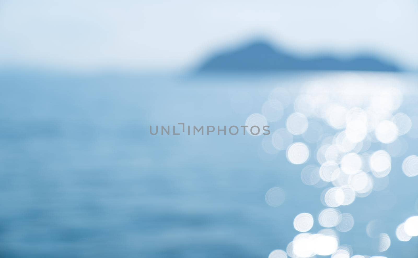 Lights on sea waves background. Blur summer sparkling sea water. by sirawit99