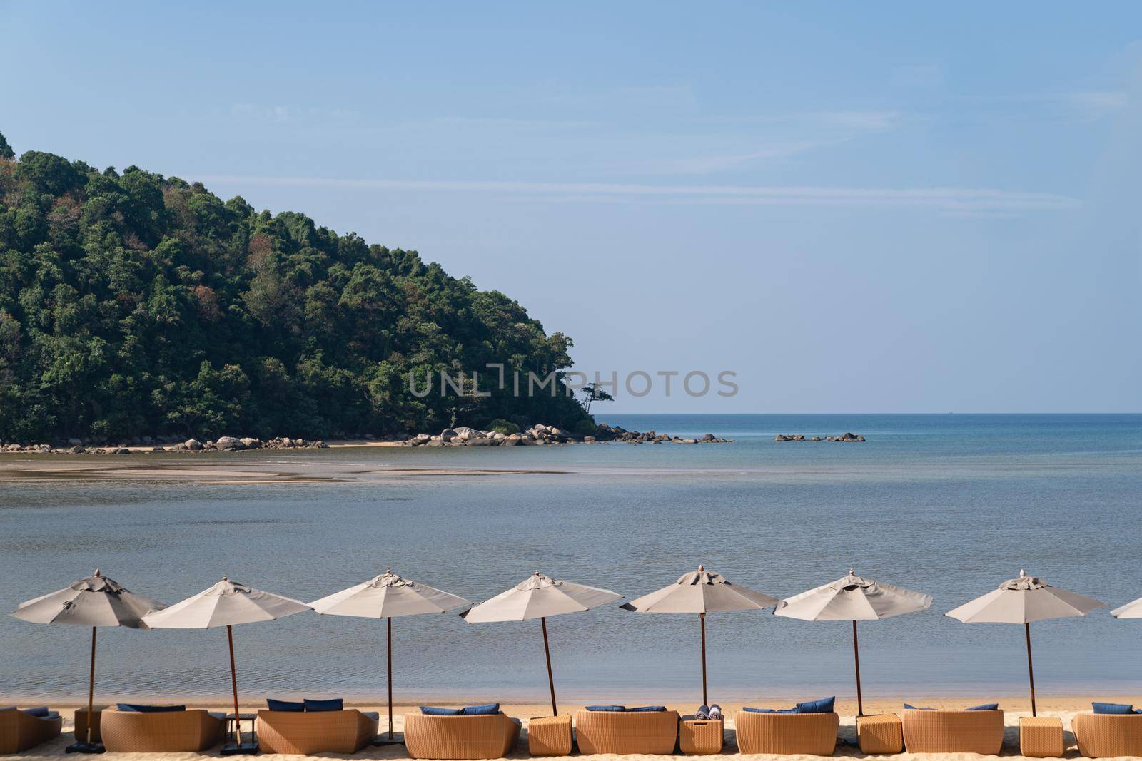 Ocean view, sea with blue sky umbrella and chair nearly beach. by sirawit99