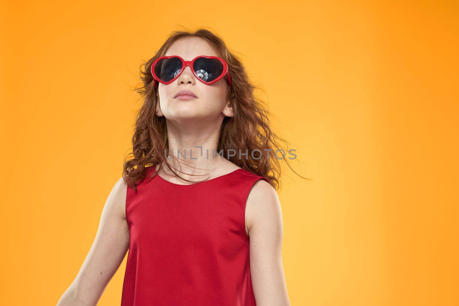 Girl in black glasses red dress childhood fun yellow background by SHOTPRIME