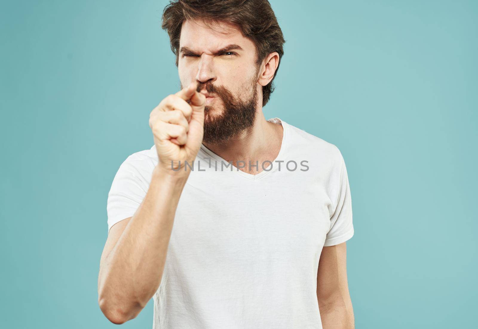 Cute man with beard on blue background emotions Copy Space cropped view by SHOTPRIME